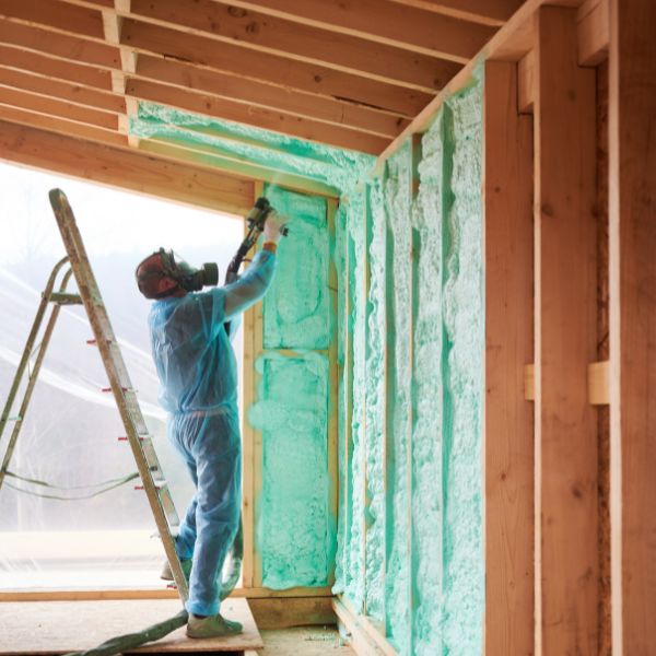 Man spraying foam insulation