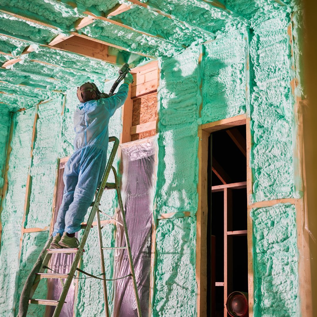 Man spraying foam insulation